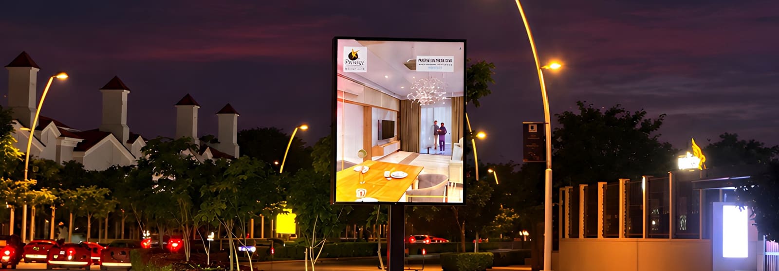 Reflective road-median branding at dusk