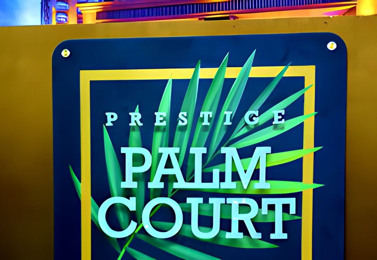 Prestige Palm Court logo at the reception